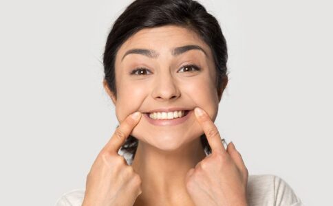 A person showing off their teeth whitening with a smile